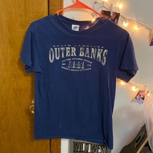 A small dark blue outer banks tshirt